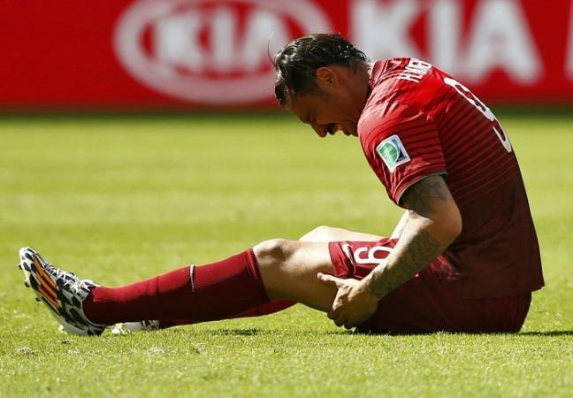 Portugal's Hugo Almeida grimaces after being injured. Hugo Almeida