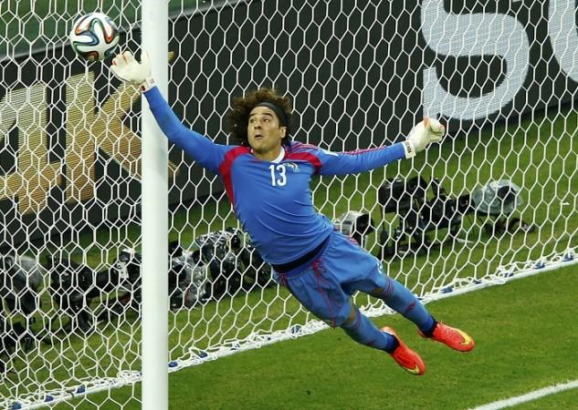 Mexico goalkeeper Guillermo Ochoa makes a stunning save to deny Brazil forward Neymar a goal, 17 June Guillermo Ochoa Mexico