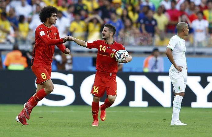 Belgium's Marouane Fellaini celebrates with Dries Mertens after scoring a goal against Algeria. Marouane Fellaini and Dries Mertens