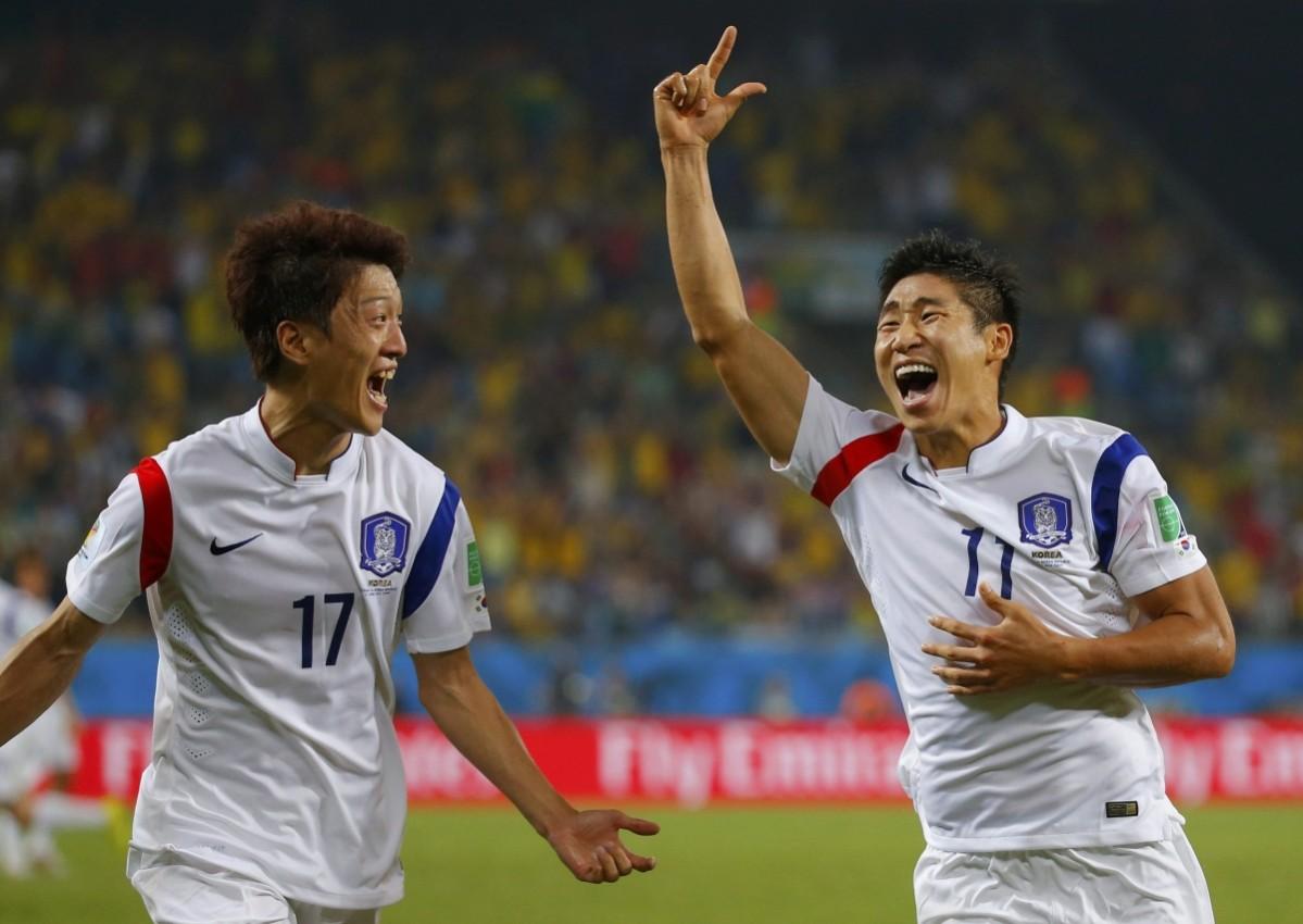 South Korea's Keun-ho celebrates his goal with teammate Chung-yong during their 2014 World Cup Group H soccer match against Russia at the Pantanal arena in Cuiaba Russia v South Korea
