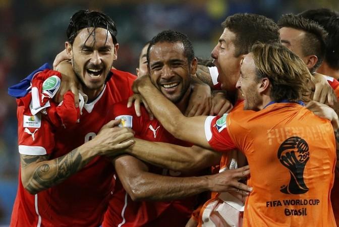 Chile's Jean Beausejour celebrates with his teammates after scoring against Australia. Jean Beausejour Chile