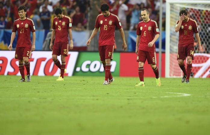 Spain players react after conceding a second goal to Chile, 18 June Spain