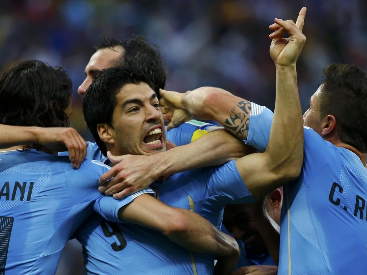 Uruguay's Suarez celebrates after scoring during their 2014 World Cup Group D soccer match against England in Sao Paulo Uruguay v England