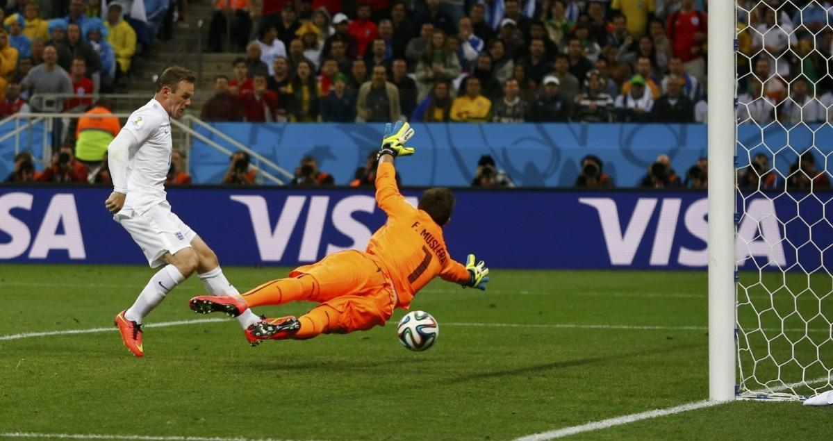 England's Rooney scores goal past Uruguay's Muslera during their 2014 World Cup Group D soccer match at the Corinthians arena in Sao Paulo Uruguay v England