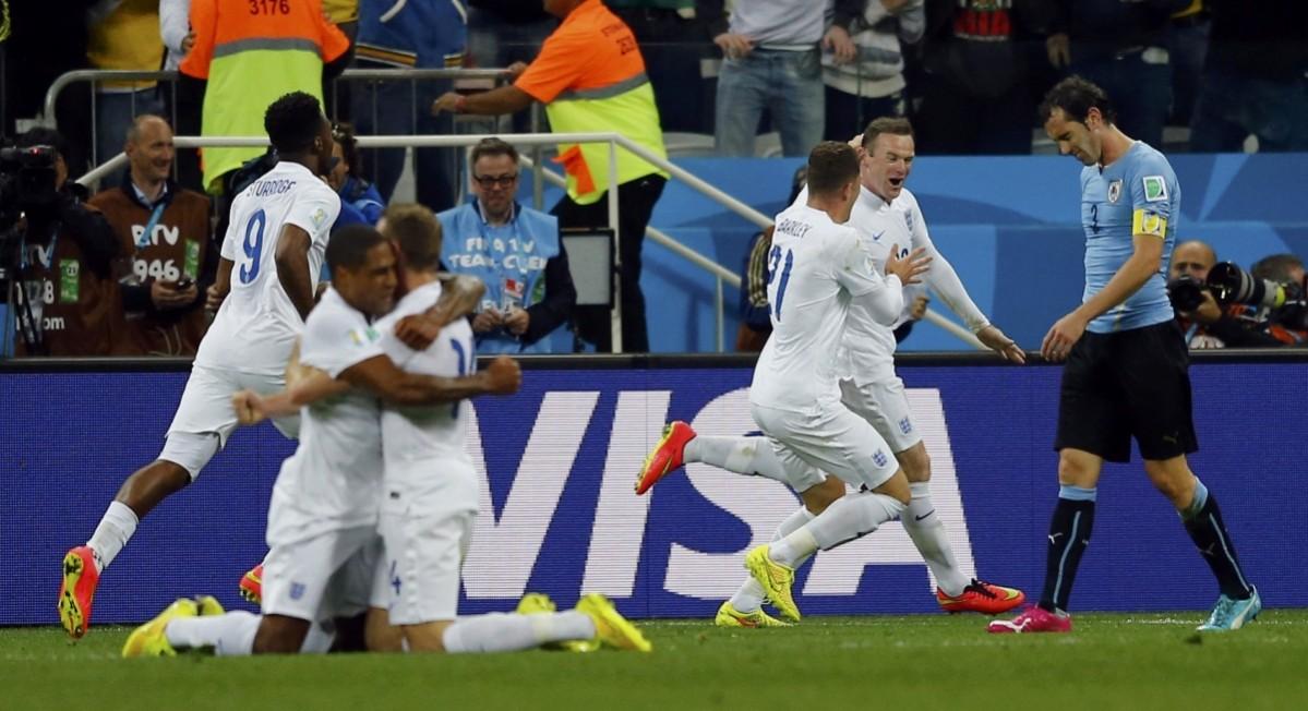 England's Rooney celebrates after scoring against Uruguay during their 2014 World Cup Group D soccer match at the Corinthians arena in Sao Paulo Uruguay v England