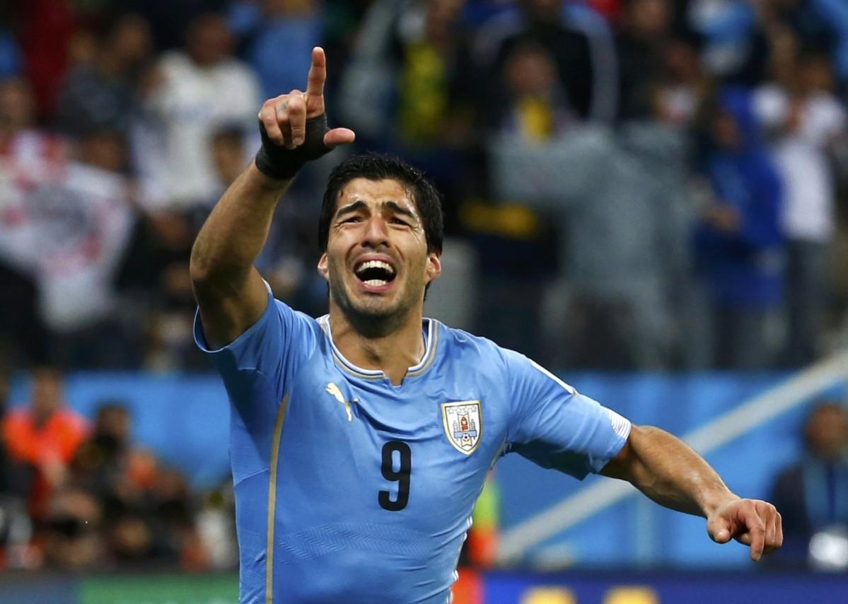 Uruguay's Luis Suarez celebrates after scoring his 2nd goal during the 2014 World Cup Group D soccer match between Uruguay and England at the Corinthians arena Uruguay v England