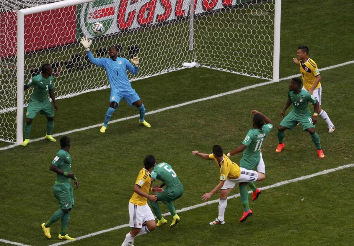 Colombia's Rodriguez scores past Ivory Coast's Barry during their 2014 World Cup Group C soccer match in Brasilia Colombia vs Ivory Coast