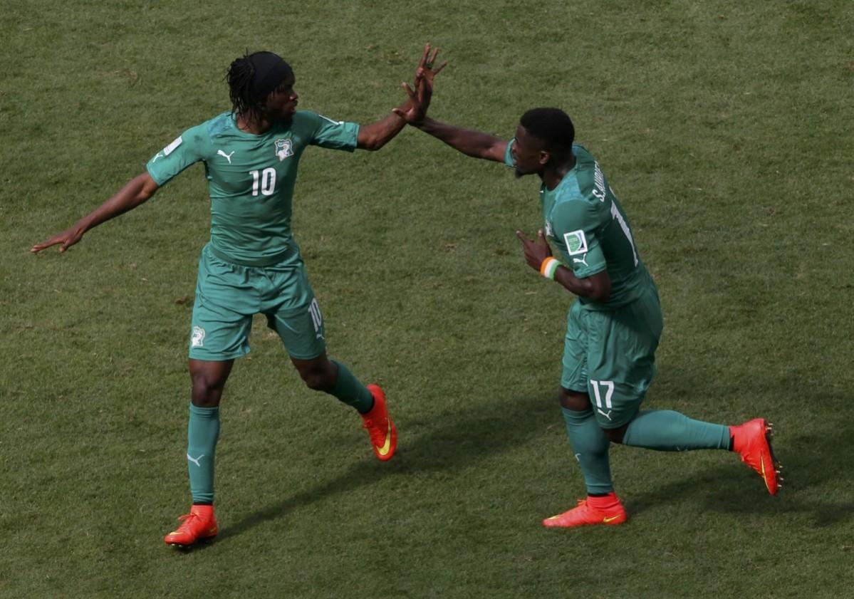 Ivory Coast's Gervinho celebrates with teammate Aurier after scoring during their 2014 World Cup Group C soccer match against Colombia in Brasilia Colombia vs Ivory Coast