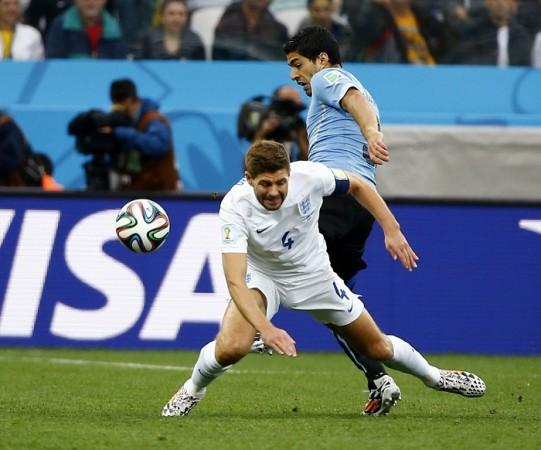 England's Steven Gerrard fights for the ball with Uruguay's Luis Suarez. Steven Gerrard