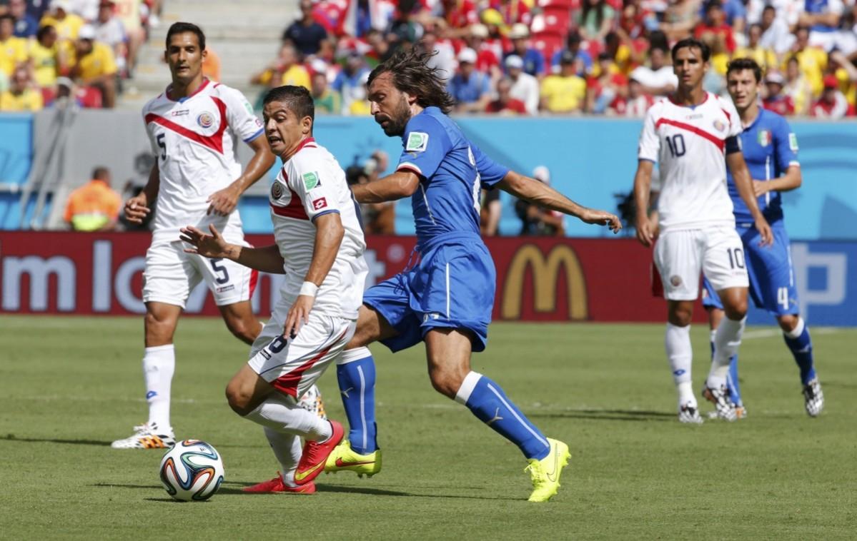 Costa Rica's Oscar Duarte fights for the ball with Italy's Andrea Pirlo as Costa Rica's Celso Borges watches during their 2014 World Cup Group D soccer match at the Pernambuco arena in Recife Italy vs Costa Rica