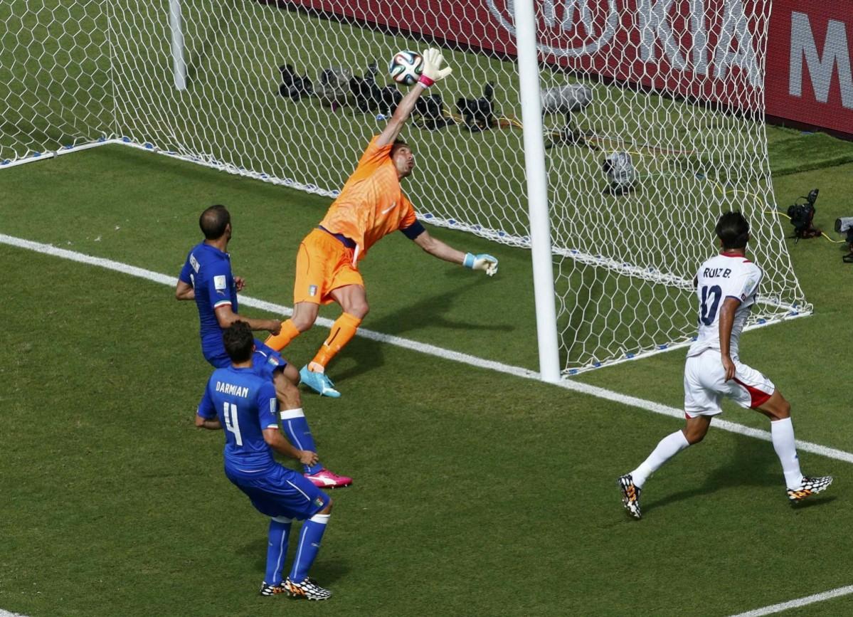 Costa Rica's Bryan Ruiz scores a goal against Italy's Gianluigi Buffon during their 2014 World Cup Group D soccer match at the Pernambuco arena in Recife Italy vs Costa Rica