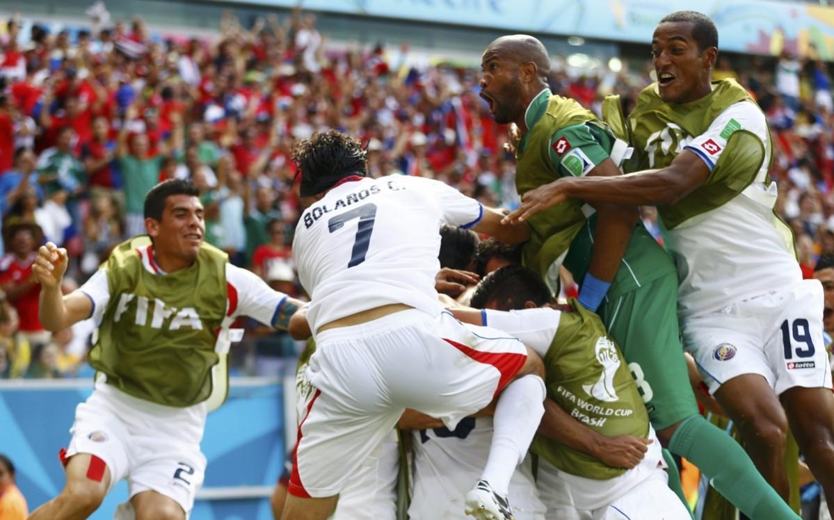 Costa Rica's Ruiz celebrates with teammates after scoring a goal during their 2014 World Cup Group D soccer match against Italy at the Pernambuco arena in Recife Italy vs Costa Rica