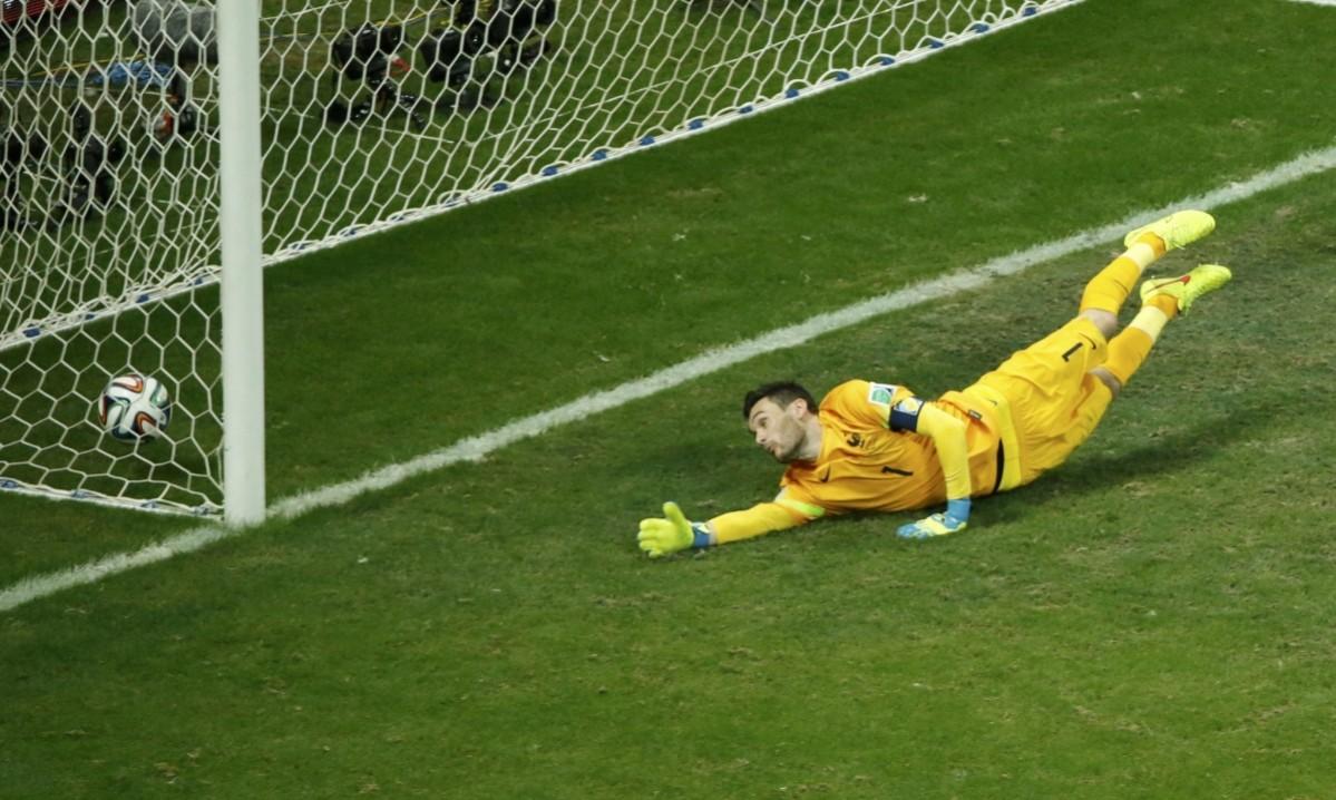 Switzerland's Blerim Dzemaili scores a goal past France's goalkeeper Hugo Lloris during their 2014 World Cup Group E soccer match at the Fonte Nova arena in Salvador Switzerland vs France