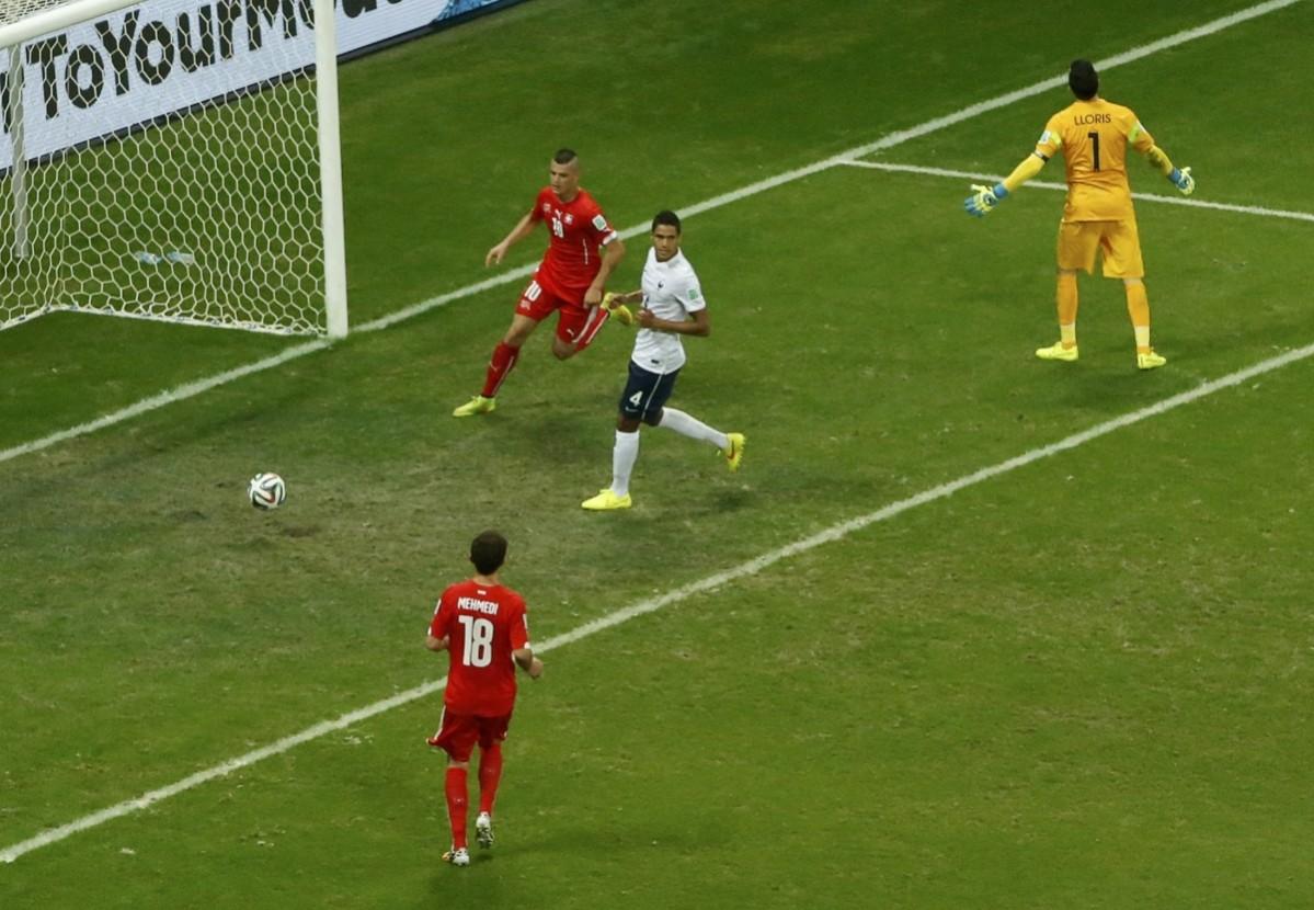 Switzerland's Granit Xhaka scores past France's goalkeeper Hugo Lloris during their 2014 World Cup Group E soccer match at the Fonte Nova arena Switzerland vs France