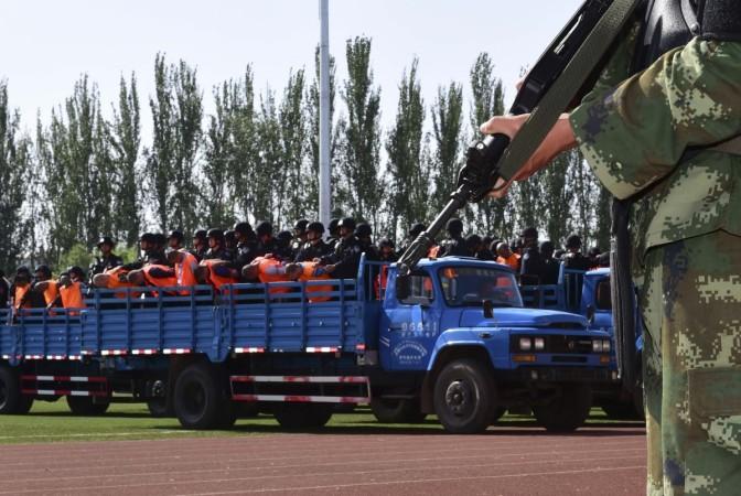 Criminals and suspects are transported to a stadium for a mass sentencing rally in Yili, Xinjiang Uighur Autonomous Region Criminals and suspects are transported to a stadium for a mass sentencing rally in Yili, Xinjiang Uighur Autonomous Region