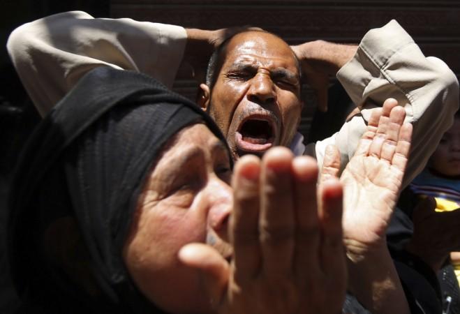 Relatives and families of members of the Muslim Brotherhood and supporters of ousted Egyptian President Mursi react outside a court in Minya, south of Cairo Relatives and families of members of the Muslim Brotherhood and supporters of ousted Egyptian President Mursi react outside a court in Minya, south of Cairo