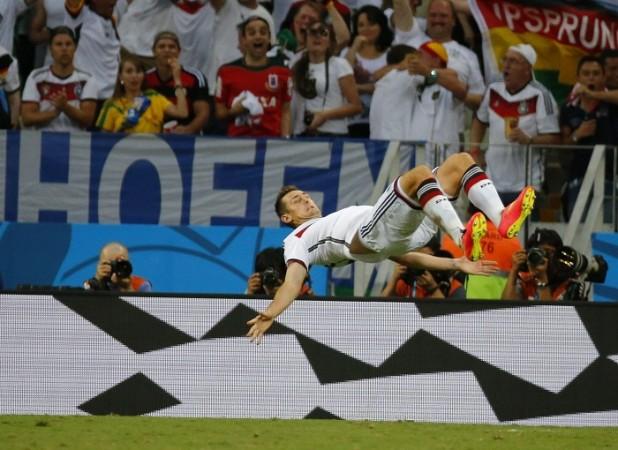 Germany's Miroslav Klose performs his trademark somersault after scoring against Ghana. Miroslav Klose somersault