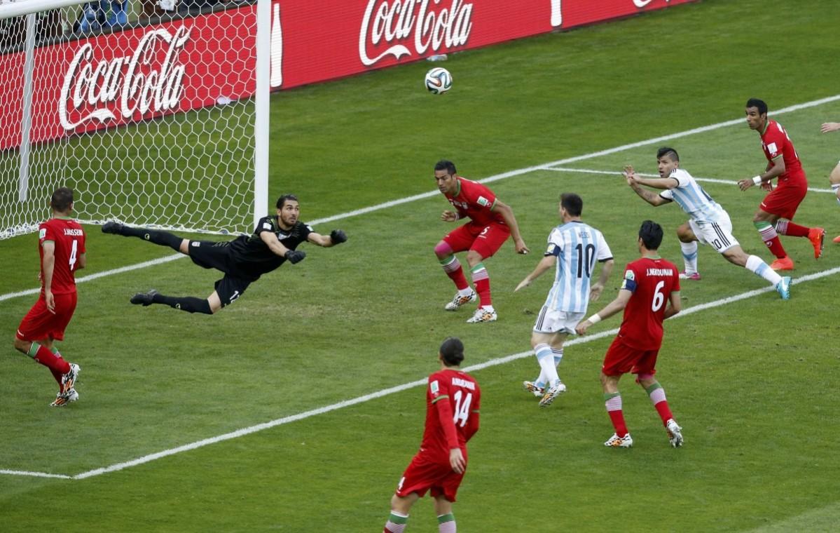 Iran's goalkeeper Haghighi makes a save during their 2014 World Cup Group F match against Argentina at the Mineirao stadium in Belo Horizonte Argentina vs Iran