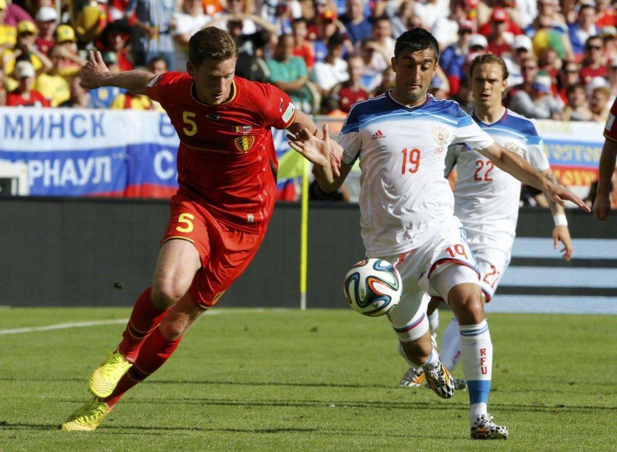 Belgium's Jan Vertonghen fights for the ball against Russia's Alexander Samedov during their 2014 World Cup Group H match at the Maracana stadium in Rio de Janeiro Belgium vs Russia