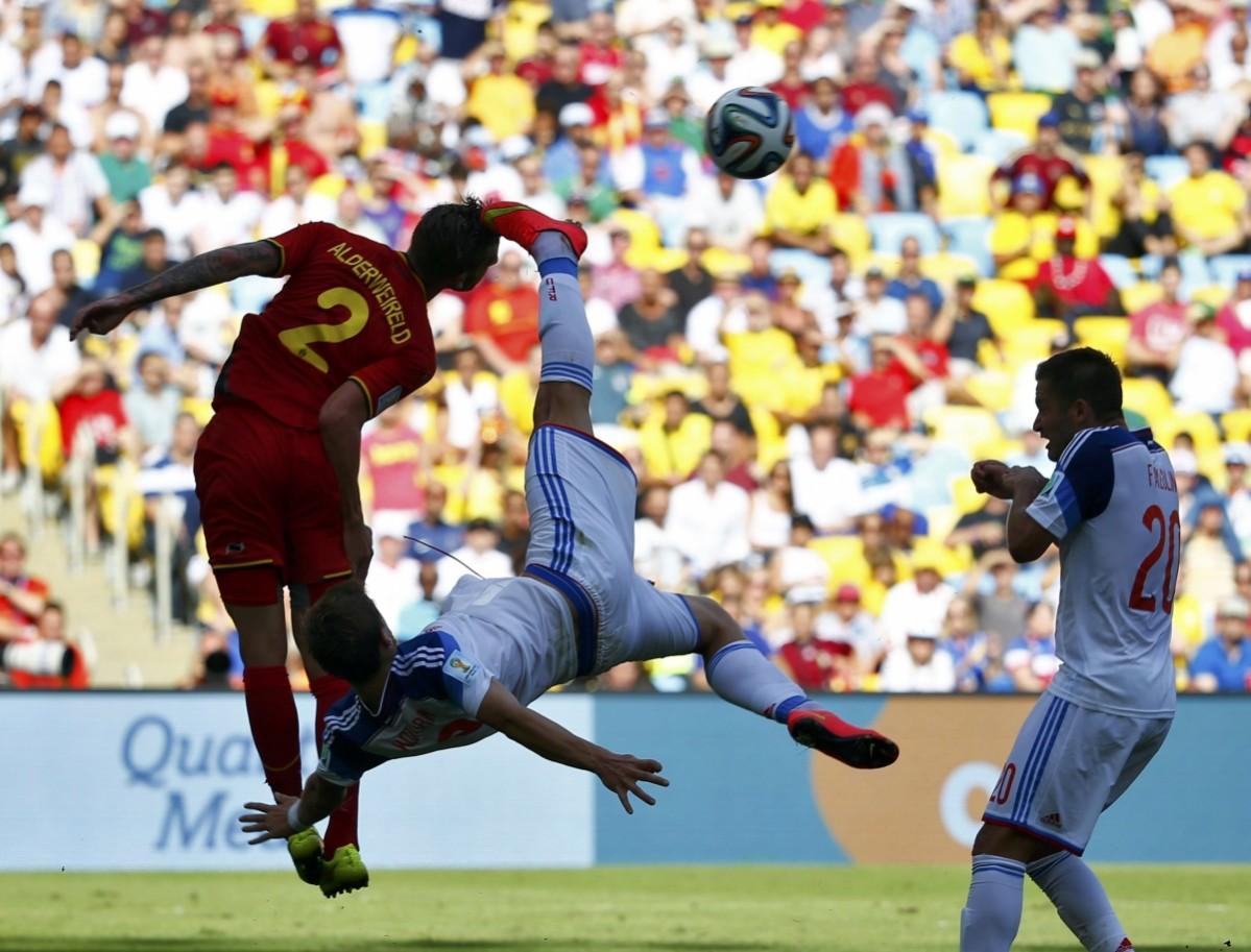 Russia's Kokorin and Belgium's Alderweireld fight for the ball during their 2014 World Cup Group H match at the Maracana stadium in Rio de Janeiro Belgium vs Russia