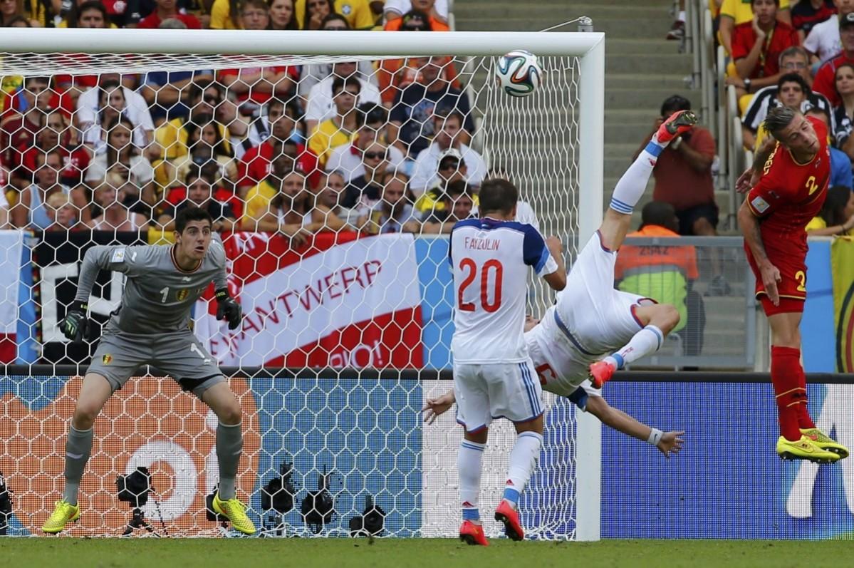 Russia's Kokorin bicycle kicks the ball towards the goal but fails to get it past Belgium's Courtois during their 2014 World Cup Group H soccer match at the Maracana stadium in Rio de Janeiro Belgium vs Russia