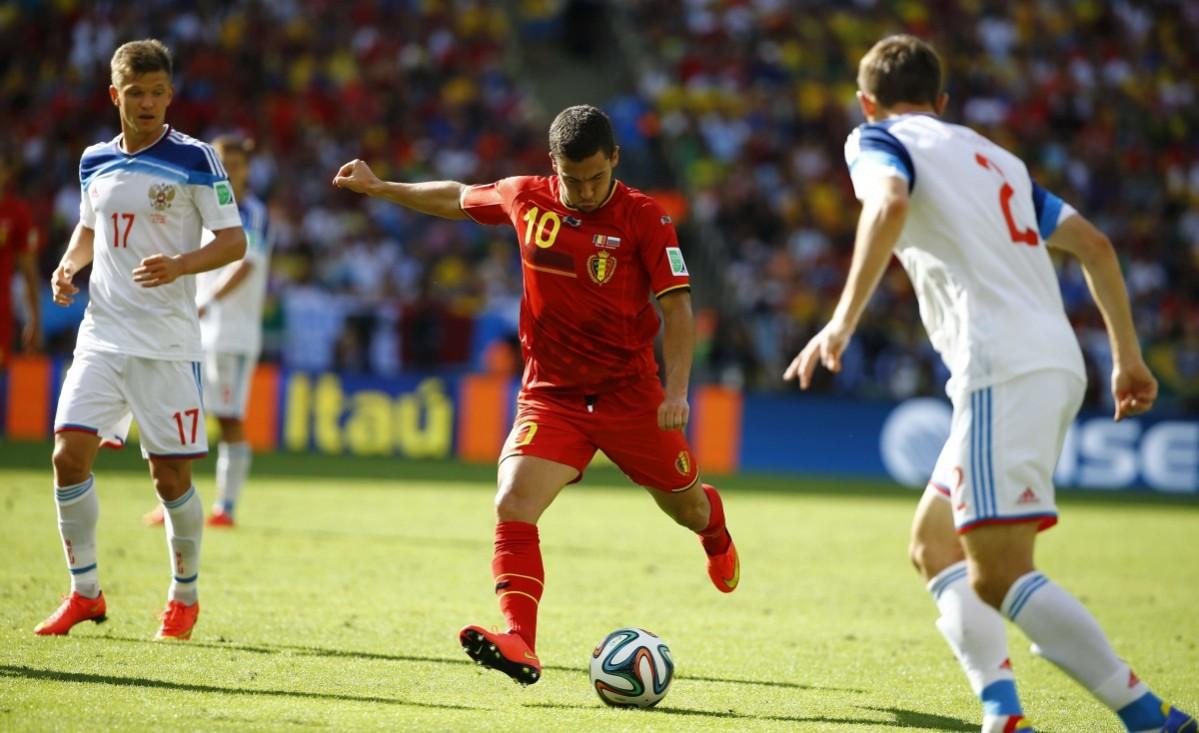 Belgium's Hazard kicks the ball next to Russia's Shatov and Russia's Kozlov during their 2014 World Cup Group H match at the Maracana stadium in Rio de Janeiro Belgium vs Russia