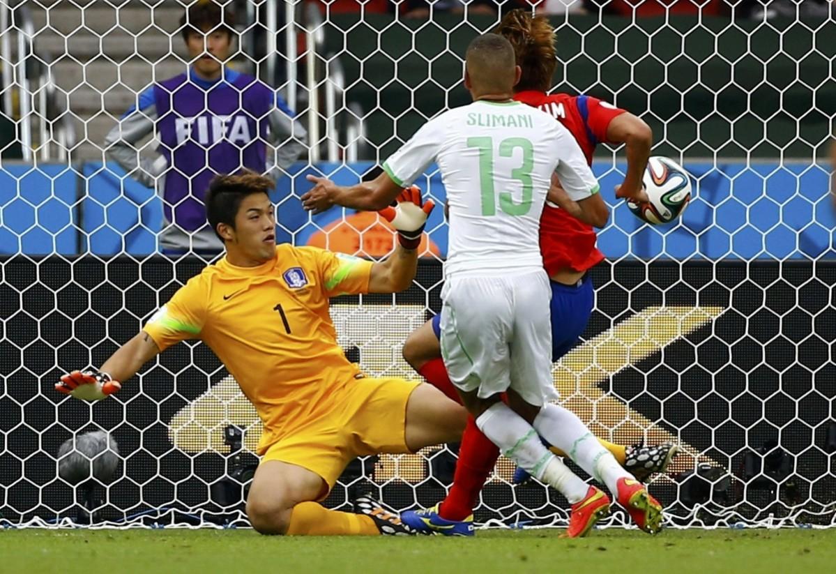 Algeria's Islam Slimani scores past South Korea's goalkeeper Jung Sung-ryong during their 2014 World Cup Group H soccer match at the Beira Rio stadium South Korea v Algeria