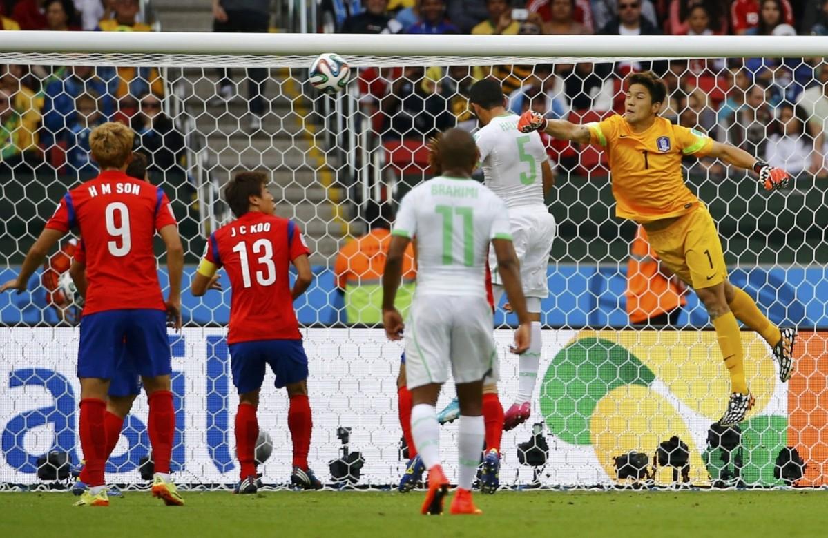 Algeria's Halliche heads to score past South Korea's Jung during their 2014 World Cup Group H soccer match at the Beira Rio stadium in Porto Alegre South Korea v Algeria