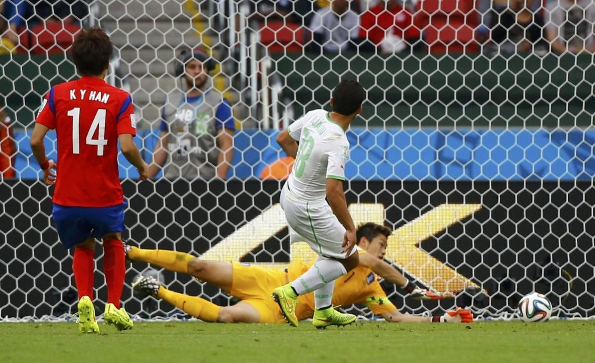 Algeria's Abdelmoumene Djabou scores past South Korea's goalkeeper Jung Sung-ryong during their 2014 World Cup Group H soccer match at the Beira Rio stadium South Korea v Algeria