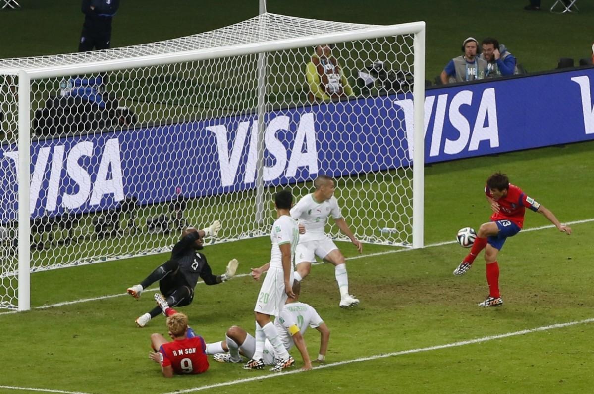 South Korea's Ja-cheol scores the team's second goal against Algeria during their 2014 World Cup Group H soccer match at the Beira Rio stadium in Porto Alegre South Korea v Algeria