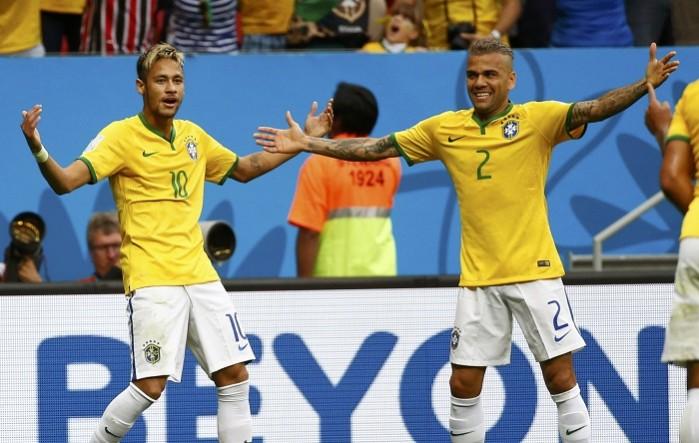 Neymar celebrates with Dani Alves after scoring against Cameroon, 23 June Neymar Dani Alves Brazil