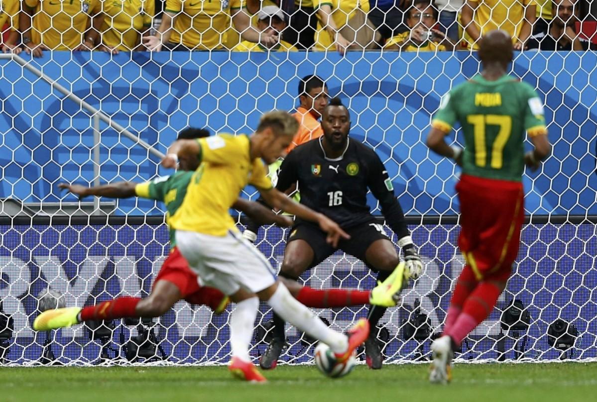 Brazil's Neymar scores his second goal during the 2014 World Cup Group A match between Cameroon and Brazil at the Brasilia national stadium Cameroon v Brazil