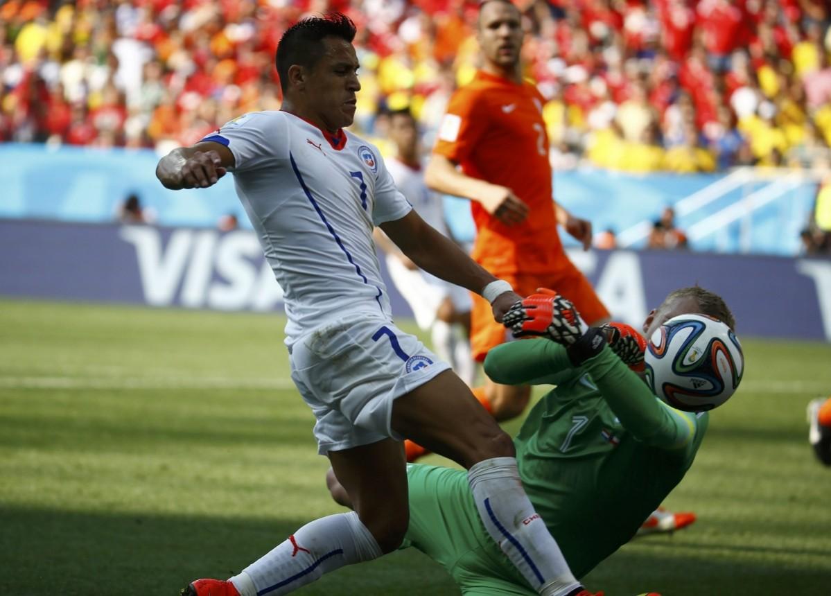 Chile's Sanchez fights for the ball with Cillessen of the Netherlands during their 2014 World Cup Group B match at the Corinthians arena in Sao Paulo Netherlands v Chile