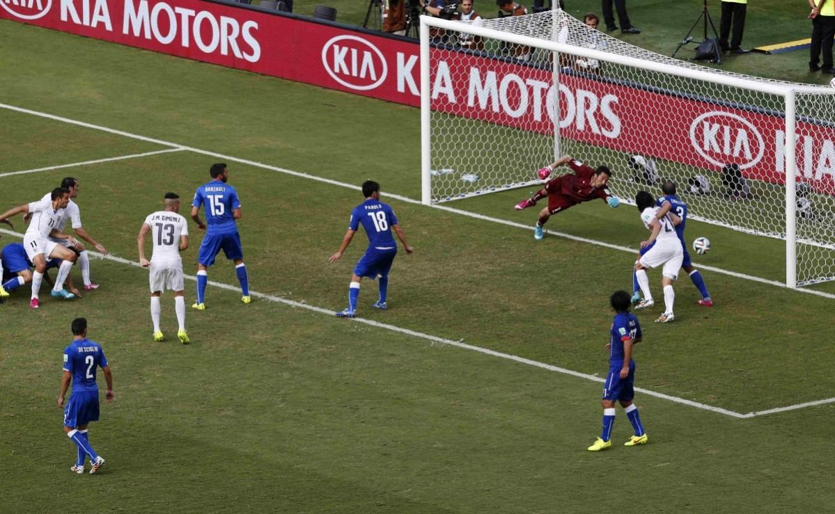 Uruguay's Diego Godin scores a goal during the 2014 World Cup Group D match between Uruguay and Italy at the Dunas arena Italy vs Uruguay