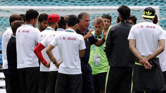 Iran coach Carlos Queiroz talks to his players during a training session, 24 June Iran Carlos Queiroz
