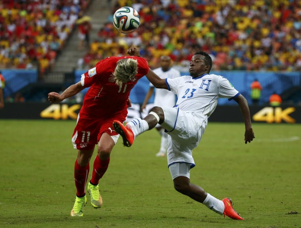 Switzerland's Valon Behrami fights for the ball with Marvin Chavez of Honduras during their 2014 World Cup Group E match at the Amazonia arena Honduras vs Switzerland