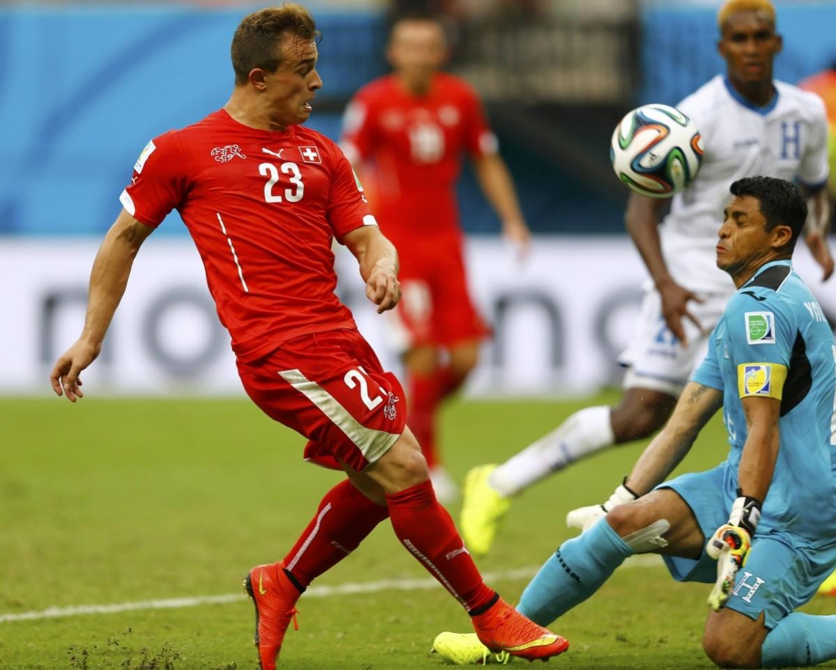 Goalkeeper Noel Valladares of Honduras blocks a shot by Switzerland's Xherdan Shaqiri during their 2014 World Cup Group E match at the Amazonia arena in Manaus Honduras vs Switzerland
