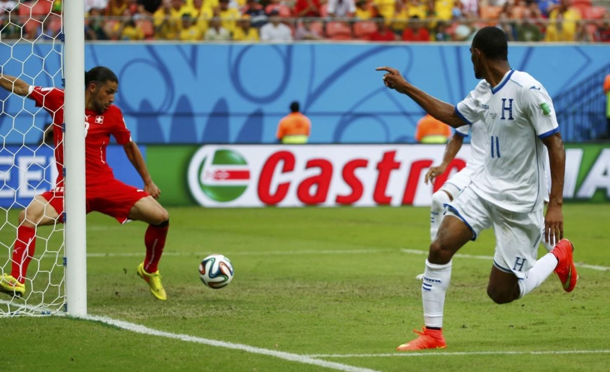 Bengtson of Honduras watches as his shot is cleared off the line by Switzerland's Rodriguez during their 2014 World Cup Group E match at the Amazonia arena in Manaus Honduras vs Switzerland