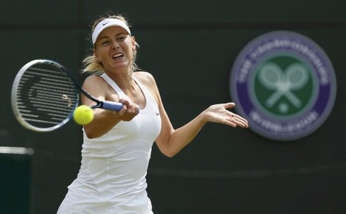 Maria Sharapova of Russia hits a return to Samantha Murray of Britain. Maria Sharapova
