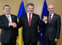 Ukraine's President Poroshenko poses with European Commission President Barroso and European Council President Van Rompuy at EU Council in Brussels