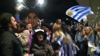 flag-waving-uruguayans-flock-to-airport-to-wait-for-suarez