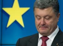 Ukraine's President Poroshenko holds pen, which ousted predecessor was due to use to sign same agreement on Nov. 29, 2013 at the EU Council in Brussels