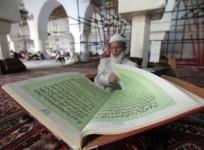 A man reading Koran
