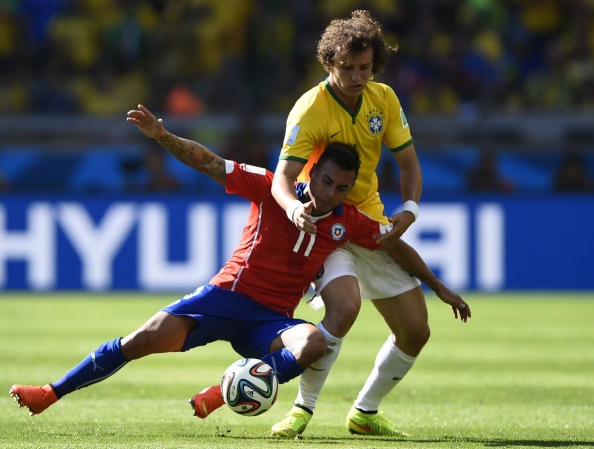 Chile's Vargas fights for the ball with Brazil's Luiz during their 2014 World Cup round of 16 game at the Mineirao stadium in Belo Horizonte Brazil v Chile