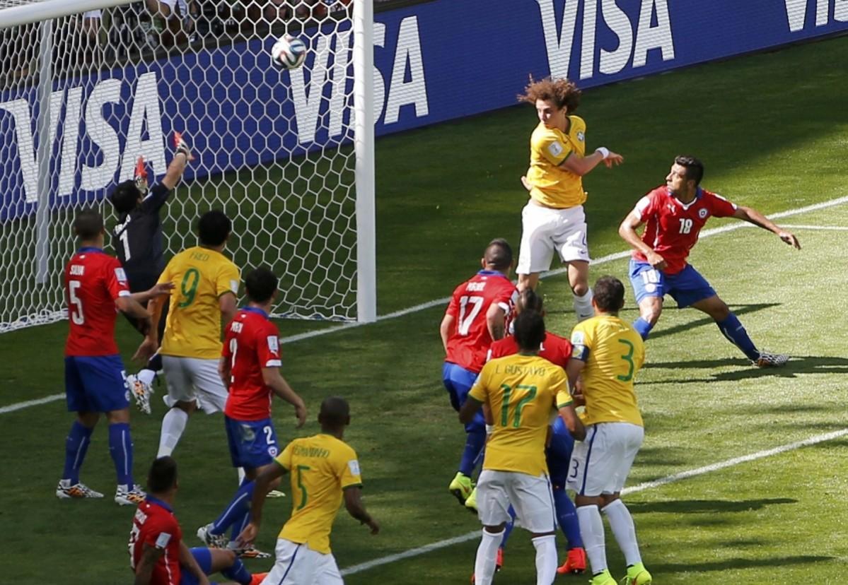 Brazil's David Luiz scores a goal during their 2014 World Cup round of 16 game against Chile at the Mineirao stadium in Belo Horizonte Brazil v Chile