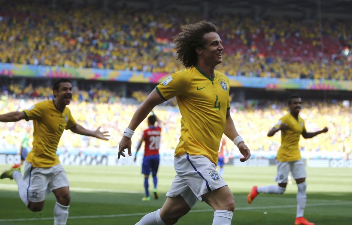 Brazil's David Luiz celebrates after scoring a goal during the 2014 World Cup round of 16 game between Brazil and Chile at the Mineirao stadium Brazil v Chile