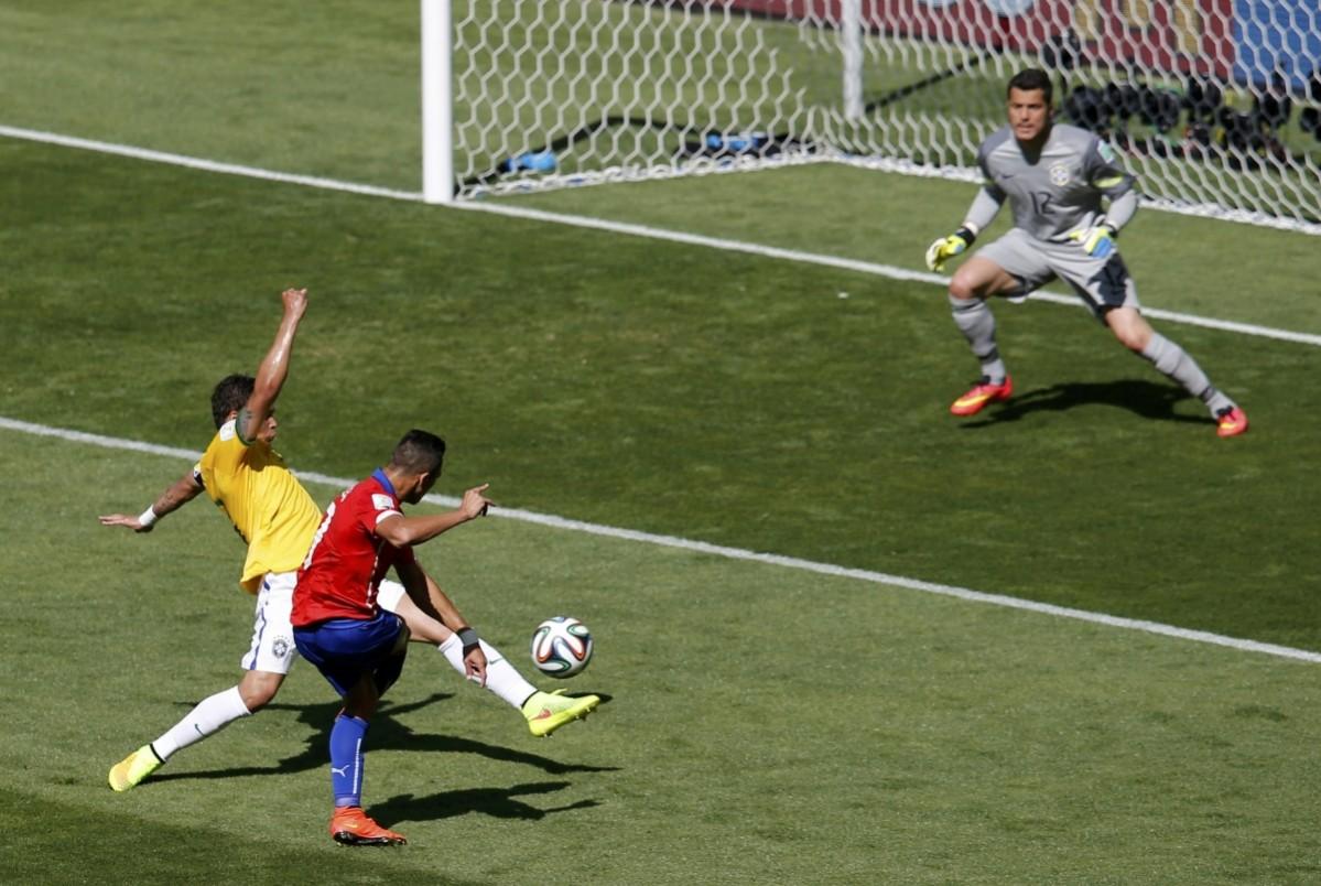 Chile's Alexis Sanchez scores a goal during their 2014 World Cup round of 16 game against Brazil at the Mineirao stadium in Belo Horizonte Brazil v Chile