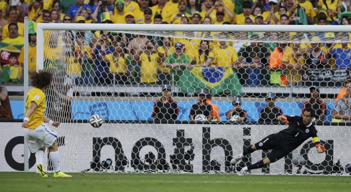 Brazil's Luiz scores his penalty past Chile's Claudio Bravo during their shootout in their 2014 World Cup round of 16 game at the Mineirao stadium in Belo Horizonte Brazil v Chile