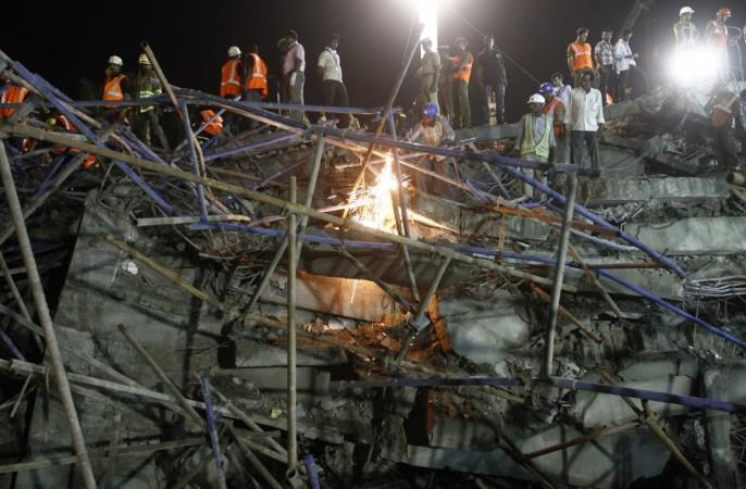 Rescue workers conduct a search operation for survivors at the site of a collapsed 11-storey building that was under construction on the outskirts of the southern Indian city of Chennai. Rescue workers conduct a search operation for survivors at the site of a collapsed 11-storey building that was under construction on the outskirts of the southern Indian city of Chennai