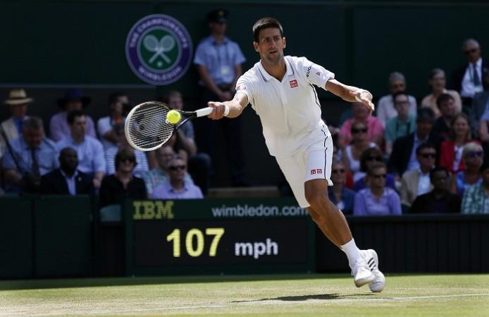 Novak Djokovic hits a return to Gilles Simon during their match at the Wimbledon. Novak Djokovic